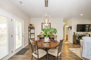 Dining space with wood-type flooring