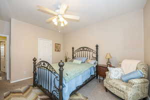 Bedroom featuring carpet floors and ceiling fan