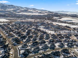 Snowy aerial view featuring a mountain view