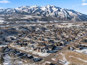 Snowy aerial view featuring a mountain view