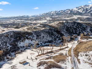 Snowy aerial view with a mountain view