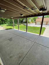 View of patio / terrace featuring a garage