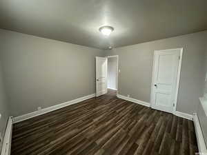 Unit 3 bedroom #2  featuring dark hardwood / wood-style flooring and baseboard heating