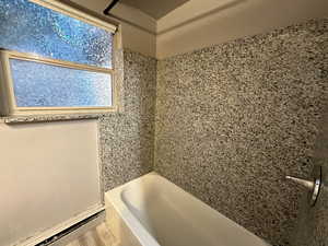 Unit 2 Bathroom with hardwood / wood-style floors