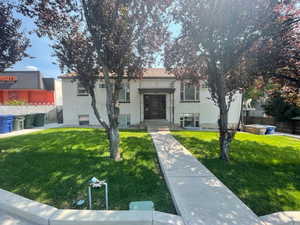 View of front of property featuring a front lawn