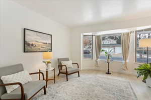 Living area with light hardwood / wood-style floors