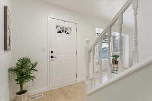 Foyer featuring light wood-type flooring