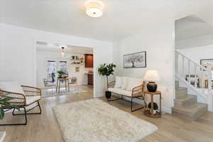 Living area with light hardwood / wood-style floors