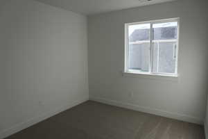 View of carpeted spare room