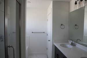 Bathroom featuring vanity and a bathing tub