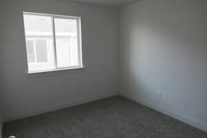 Spare room with carpet flooring