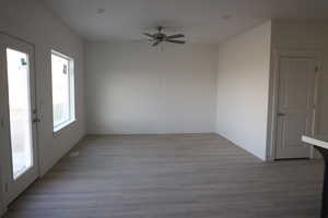 Unfurnished room featuring light hardwood / wood-style floors and ceiling fan