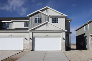 View of front of property with a garage