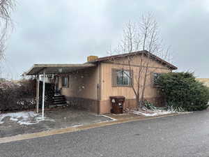 View of front of home featuring a carport