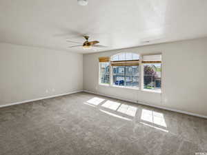 Master Bedroom with ceiling fan and carpet floors