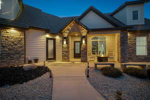 Property entrance with a patio