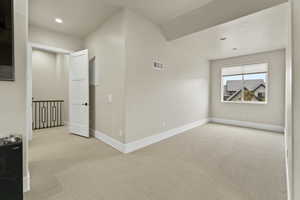 Interior space featuring light colored carpet