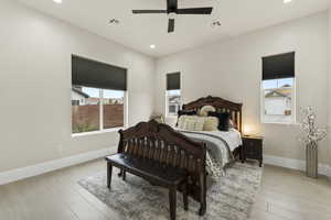 Bedroom featuring ceiling fan and light hardwood / wood-style flooring