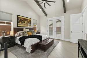 Primary Bedroom with french doors, access to outside, ceiling fan, beam ceiling, and light hardwood / wood-style flooring