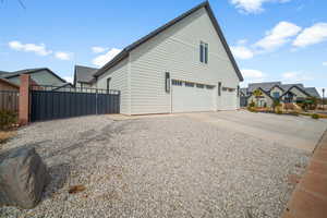 View of property exterior with a garage