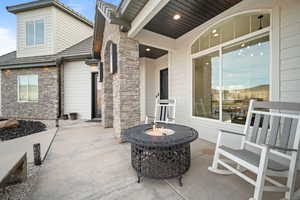 View of patio / terrace featuring an outdoor fire pit