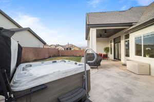 View of patio / terrace with a hot tub