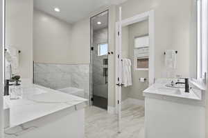 Ensuite Bathroom featuring vanity and an enclosed shower