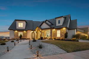 View of front of home featuring a yard