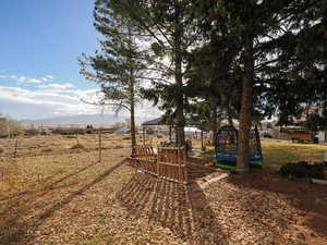 View of yard with a gazebo, a mountain view