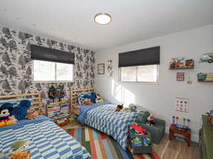 Bedroom featuring wood-type flooring