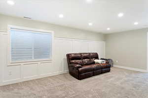 Sitting room with light colored carpet