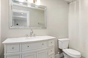 Bathroom with vanity and toilet