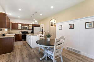 Dining room with sink and hardwood / wood-style flooring