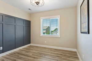 Unfurnished bedroom featuring light wood-type flooring and a closet