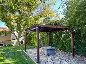 View of yard featuring a patio area and a pergola