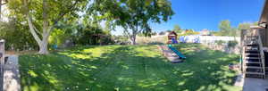 View of yard featuring a playground