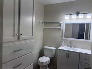 Bathroom with vanity and toilet