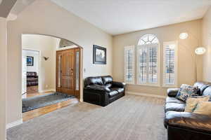 Living room featuring light carpet