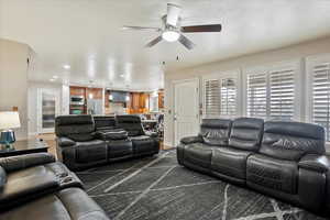 Living room featuring ceiling fan