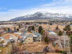 Birds eye view of property with a mountain view