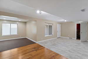 Spare room featuring light wood-style floors and recessed lighting