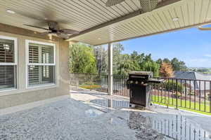 View of patio / terrace with grilling area and ceiling fan