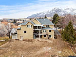 Back of house with a mountain view