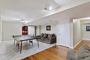 Recreation room featuring light hardwood / wood-style floors