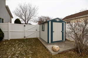 View of outbuilding with a yard