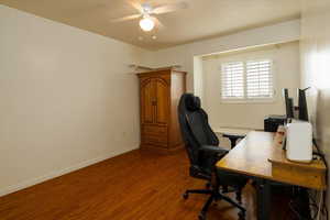 Office area featuring wood-type flooring and ceiling fan