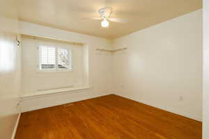 Bedroom room featuring hardwood / wood-style flooring and ceiling fan