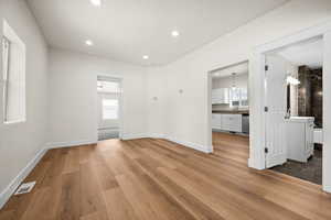 Interior space with sink and light hardwood / wood-style flooring