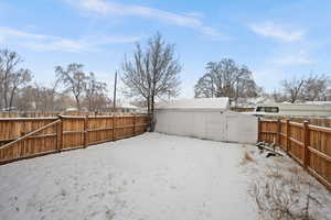 View of yard covered in snow