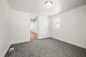 View of carpeted spare room